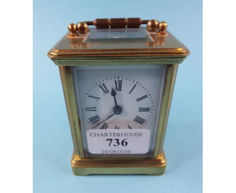 A carriage timepiece, the 4.5 cm wide enamel dial with Roman numerals, in a brass four pillar case, 12 cm high Condition repo