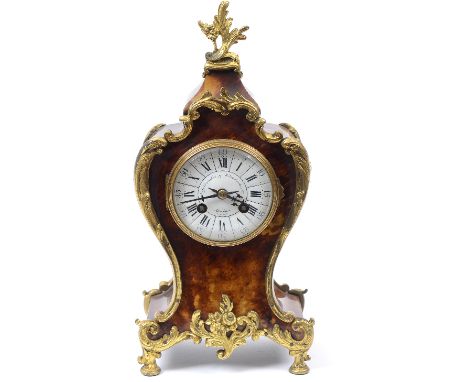A Louis XVI style clock, the 9 cm diameter enamel dial signed Goldsmiths & Silversmiths Co, London, Paris Make, with Roman nu