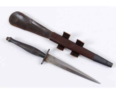 A Fairbairn & Sykes style fighting knife, the blade inscribed WILKINSON SWORD Co Ltd, London and THE F-S FIGHTING KNIFE, with