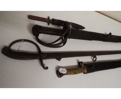 A 19th century sword and scabbard, another, a bayonet and scabbard, and a dagger and scabbard (4) Condition report Report by 