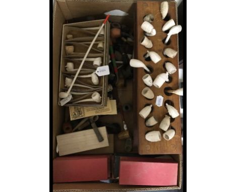 A collection of clay and other pipes, and pipe stands (box)