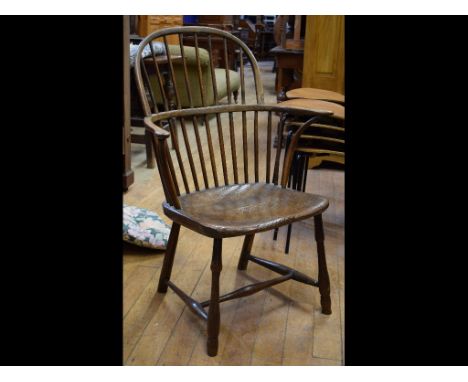 A 19th century comb back kitchen armchair, and an iron cauldron (2)