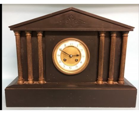A French mantel clock, fitted a movement striking on a gong, in a black slate architectural case, 31.5 cm high Condition repo