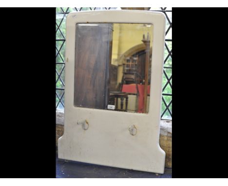A hall mirror, in an enamel frame, 63 cm wide