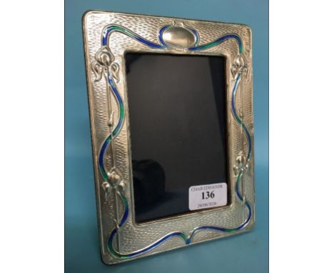 A silver photograph frame, with enamel style decoration, 19 cm high
