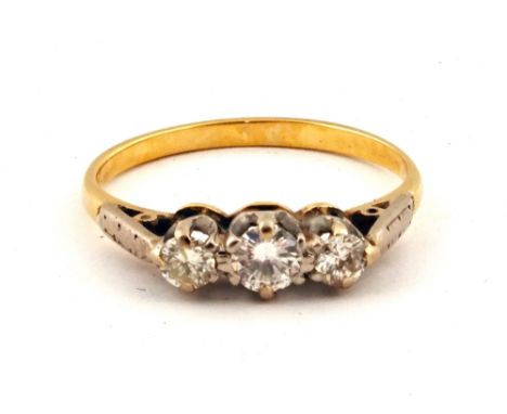 An 18ct Gold three stone Diamond ring, size L