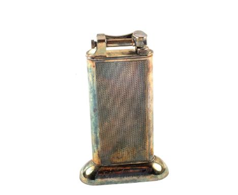 A Dunhill table lighter with engine turned decoration