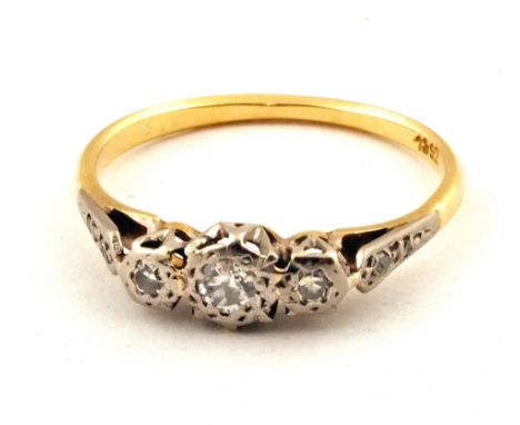 An 18ct Gold and Platinum three stone Diamond ring, size M