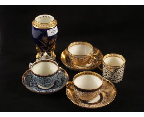 An 18th Century Worcester cup and saucer, plus two other cups and saucers and a Grainger Worcester blue and gilt vase (damage