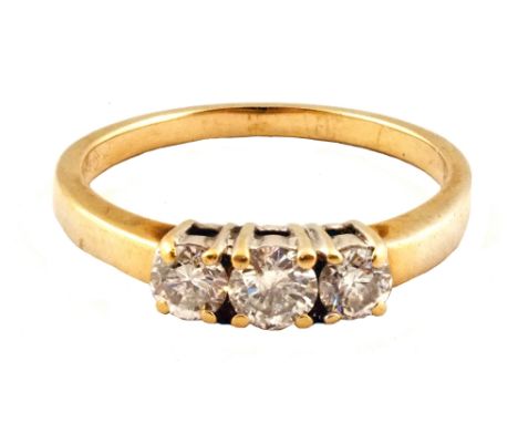 An 18ct Gold three stone Diamond ring, size Q