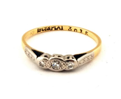 An 18ct Gold ring set with three Diamonds, size M