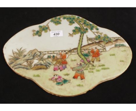 A Chinese porcelain panel with Chinese figures playing, 14" x 10"