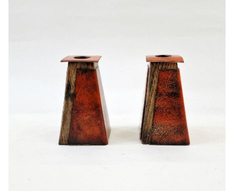 Pair of late 20th century copper, enamel and wooden-mounted candlestick holders, in orange, 11cm high (2)&nbsp;