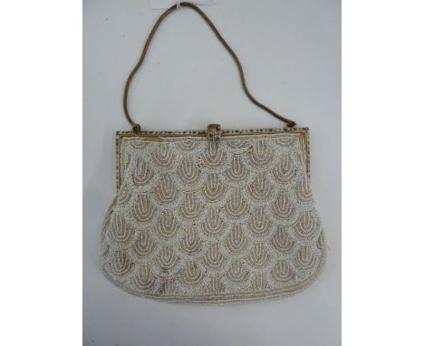 1920's white beaded evening bag, fixed frame with enamel decoration, red and blue flowers with green stems and leaves, enamel