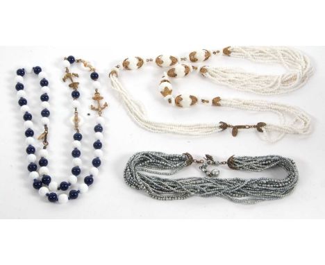 Three necklaces by Miriam Haskell, the first with blue and white glass beads with gilt metal anchors, with clasp stamped Miri