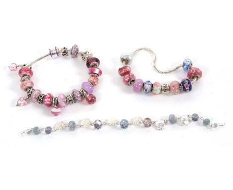 A quantity of costume jewellery to include a Pandora style bracelet, chain and glass beads stamped 925, together with another