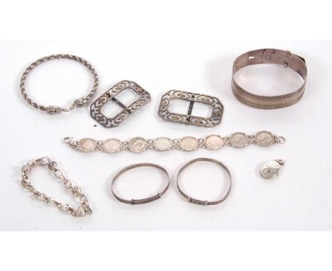 A quantity of silver and white metal jewellery to include a 2cm wide buckle bangle stamped 'sterling silver', a pair of silve