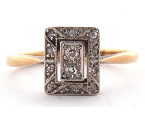 An Edwardian 18ct diamond ring, the rectangular plaque set with single and rose cut diamonds, all set in white metal to a pla