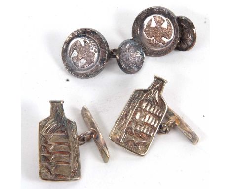 Two pairs of silver cufflinks by Malcolm Appleby: the first a pair depicting a dove carrying an olive branch, hallmarked Edin