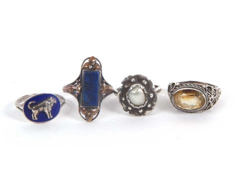 Four rings: to include a white metal and cultured baroque pearl ring, with scalloped border with bead decoration, unmarked (t