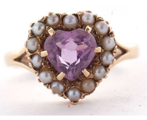 A 9ct heart shape amethyst and cultured pearl ring, all claw mounted with split shoulders and plain band indistinctly stamped