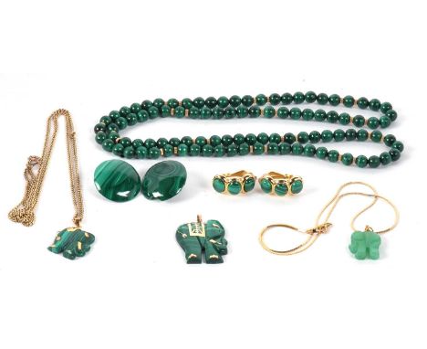 A group of malachite jewellery to include three elephant pendants, the first a malachite pendant set with a Chinese character