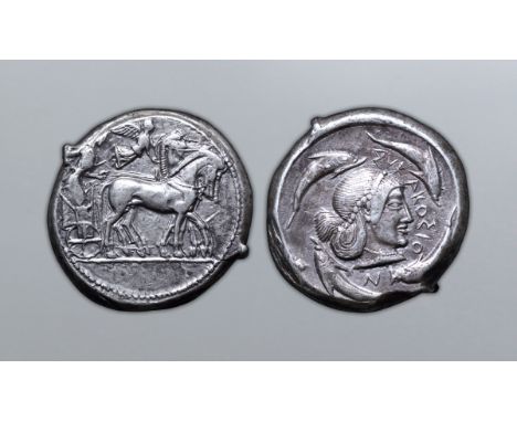 Sicily, Syracuse AR Tetradrachm. Deinomenid Tyranny. Time of Hieron I, circa 485-466 BC. Charioteer, holding kentron and rein