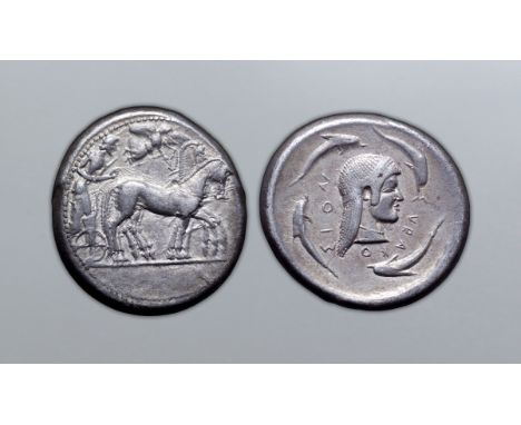 Sicily, Syracuse AR Tetradrachm. Deinomenid Tyranny. Time of Hieron I, circa 480-475 BC. Charioteer, holding kentron and rein
