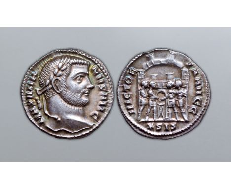 Maximian AR Argenteus. Siscia, AD 295. MAXIMIANVS AVG, laureate head right / VICTORIA AVGG, the four tetrarchs sacrificing ov