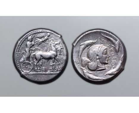 Sicily, Syracuse AR Tetradrachm. Deinomenid Tyranny. Time of Hieron I, circa 480-475 BC. Charioteer, holding kentron and rein