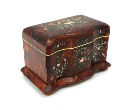 A 19TH CENTURY TORTOISESHELL-VENEERED, MOTHER OF PEARL-INLAID AND IVORY-BANDED TEA CADDY With domed top and serpentine front,