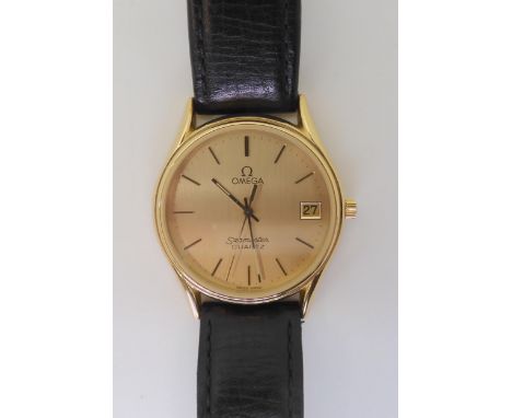 AN OMEGA SEAMASTER QUARTZ with a gold plated case, gold coloured dial with baton numerals and hands, and a date aperture. Wit