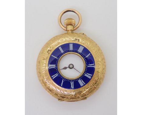 AN 18CT HALF HUNTER FOB WATCH with a blue enamel chapter ring with white Roman numerals, all over foliate hand engraving, the