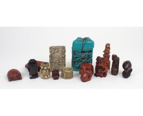 A GROUP OF CARVED HARDWOOD NETSUKE Comprising; skull, monkey, turtle, bird, dragon, frog, figures and shishi, various ceramic