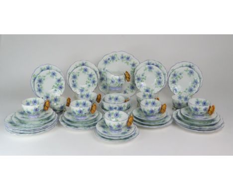 AN ART DECO AYNSLEY BUTTERFLY HANDLE TEASET the whole decorated with cornflowers, comprising ten cups and saucers, nine 15cm 