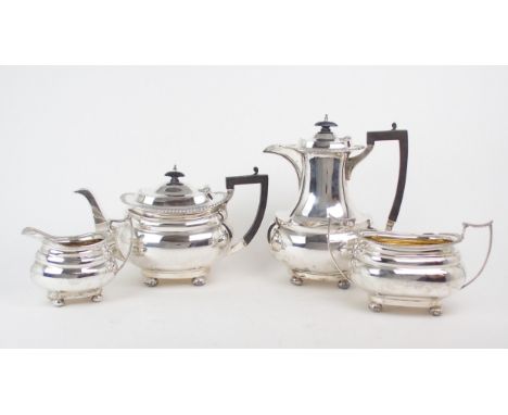 A GEORGE V FOUR PIECE SILVER TEA SERVICE by James Deakin &amp; Sons, Sheffield 1918, of swollen baluster form, with gadrooned