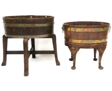 &nbsp;TWO OAK OVAL COOPERED WINE COOLERS ON STANDS&nbsp; the first with ivorine label to interior "R,A, Lister &amp; Co Durle