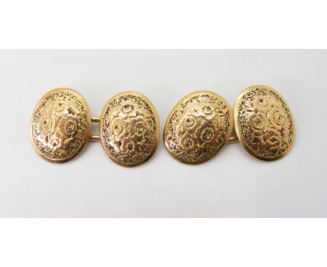 A PAIR OF VINTAGE CUFFLINKS engraved to both faces with roses and foliage, un-hallmarked yellow metal, weight 8.2gms Conditio
