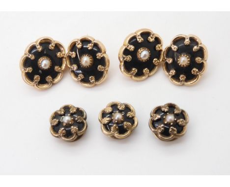 A VINTAGE SET OF CUFFLINKS AND STUDS mounted in yellow metal, set with black glass and pearls, in original red shaped box fro
