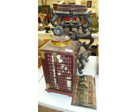 Three Oriental carved wood planter stands and an abacus table lamp, (4).