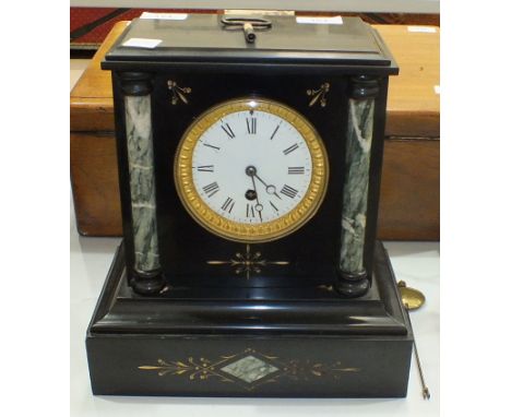 A Victorian black slate and marble mantel clock of architectural form with white enamel dial and drum movement, 39cm high.