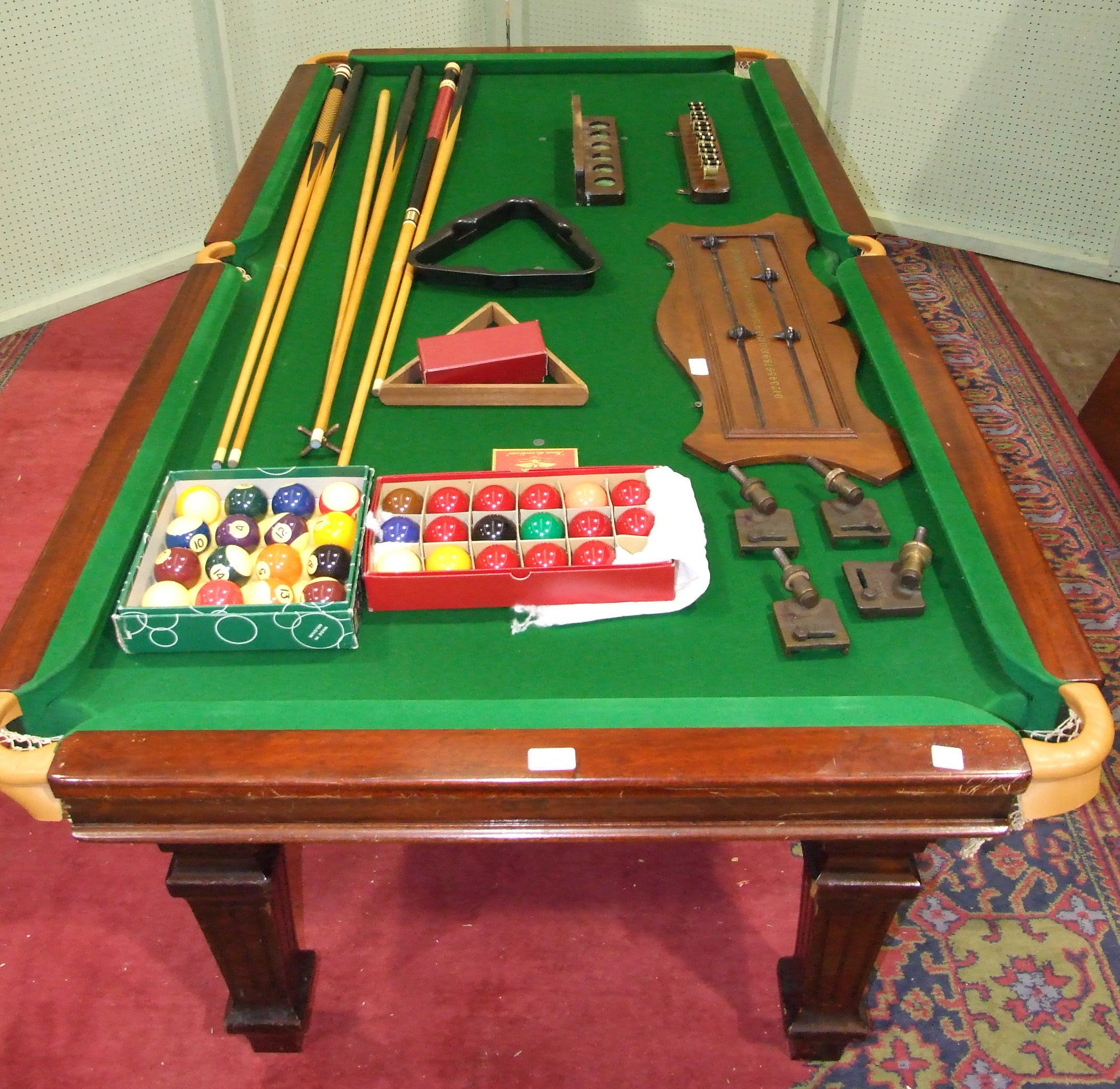 An early20th century mahogany slatebed quartersize snooker table