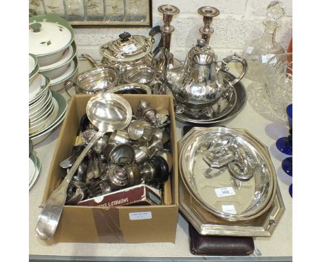 A three-piece silver-plated tea service, two entrée dishes, cutlery and other plated ware.