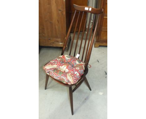 A set of four Ercol dark wood stick-back chairs, (4).