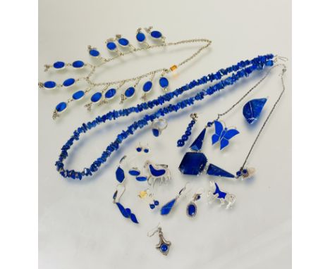 A collection of Lapis Lazuli mounted white metal jewellery to include a thong style necklace L x 29cm, triangular style panel