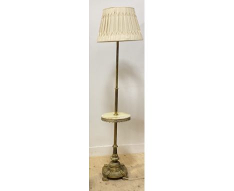 An early 20th century cast brass telescopic lamp standard, with four branches and circular onyx open shelf on a circular base