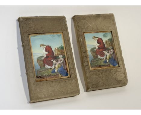 A pair of frosted etched glass bookends in the style of a book with a picture panel to centre of a 18thc religious scene. (h-