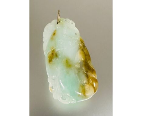 A eastern modern celadon mottled and russet jade gourd pendant with carved scrolling leaves and tendrils with yellow metal lo