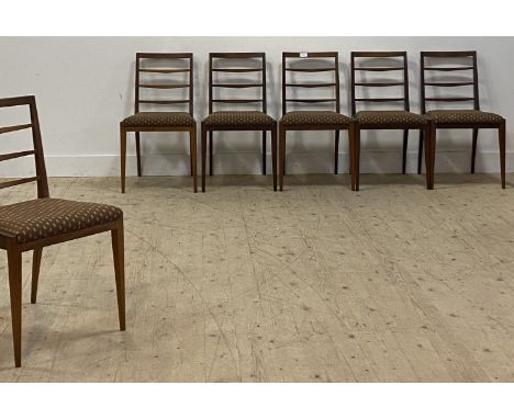 McIntosh of Kircaldy, a set of six mid century teak dining chairs, with ladder backs and upholstered seat pads, raised on squ