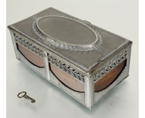 A Edwardian pewter mounted oak box, the top with oval panel enclosed within a laurel leaf border enclosing a plain interior w